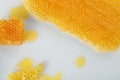 Natural honeycombs with tasty honey on white background, flat lay