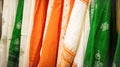 Natural Indian fabrics in bright colors orange, white, green for tailoring traditional festive clothes. Concept