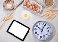Natural ingredients for baking with tablet Royalty Free Stock Photo