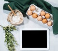 Natural ingredients for baking with tablet Royalty Free Stock Photo