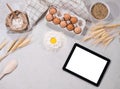 Natural ingredients for baking with tablet Royalty Free Stock Photo