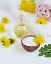 Natural ingredients for homemade body salt scrub with dandelion flowers, lemon, honey and olive oil Royalty Free Stock Photo