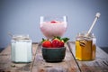 Natural ingredients for strawberry smoothie: strawberries, honey and yogurt Royalty Free Stock Photo