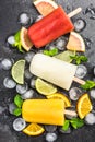 Natural juice homemade healthy popsicles over ice cubes Royalty Free Stock Photo