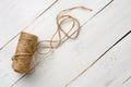 Jute twine roll on white wooden background. Tools for handmade hobby. Copy space Royalty Free Stock Photo