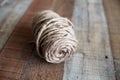 Natural jute twine roll on wood Royalty Free Stock Photo