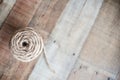Natural jute twine roll on wood Royalty Free Stock Photo