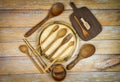 Natural kitchen tools wood products / Kitchen utensils background with spoon fork chopsticks bowl plate cutting board object , top Royalty Free Stock Photo