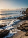 A natural landscape of a beautiful beach with a big sea view, rocks, retro sunset, fluffy clouds, sandy beach, stunning, wallart Royalty Free Stock Photo