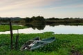 Natural landscape with boats in the water at sunset. Amazing lake with small artisanal fishing boats Royalty Free Stock Photo