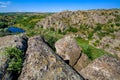 Natural landscape of the canyon with granite rocks on the top of the cliff. Royalty Free Stock Photo