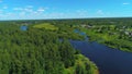 Natural landscape with green trees, wide river, and green field. Shot. Aerial view of summer landscape with forest Royalty Free Stock Photo