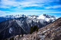 Natural landscape mountain panorama. The Snow-Capped Mountains Against A Clear Sky with clouds. Royalty Free Stock Photo