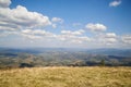 Natural landscape in the mountains in summer. Sunny rural scenery with blueberry fields and dried grass on hills. Nature Royalty Free Stock Photo