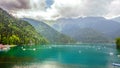 Natural landscape. Panorama view of the lake Small Ritsa. Trees reflecting in the blue from lapis lazuli water. Ritsa National Par Royalty Free Stock Photo