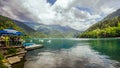 Natural landscape. Panorama view of the lake Small Ritsa. Trees reflecting in the blue from lapis lazuli water. Ritsa National Par Royalty Free Stock Photo