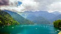 Natural landscape. Panorama view of the lake Small Ritsa. Trees reflecting in the blue from lapis lazuli water. Ritsa National Par Royalty Free Stock Photo