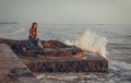 Natural landscape portrait of model with waves.