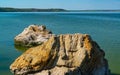 Natural landscape, shell stones in the water near the shore of the Khadzhibey estuary