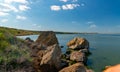 Natural landscape, shell stones in the water near the shore of the Khadzhibey estuary