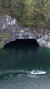 Natural landscapes of the mountain park Ruskeala in Karelia.Tourists walks by boat on the lake Royalty Free Stock Photo