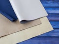 Natural leather textures samples on blue wooden background Royalty Free Stock Photo