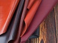 Natural leather textures samples on dark wooden background Royalty Free Stock Photo