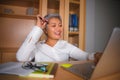 Natural lifestyle office portrait of attractive and happy successful mature Asian woman working at laptop computer desk smiling Royalty Free Stock Photo