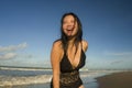 Natural lifestyle portrait of young attractive and happy Asian Korean woman in swimsuit walking on beautiful beach paradise Royalty Free Stock Photo