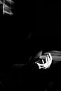 Hands of woman in sunlight. Black and white high contrast photo. Royalty Free Stock Photo
