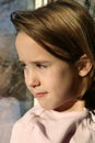 Natural light portrait of girl at window