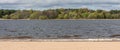 Natural lines, sand, water, forest, sky on a cloudy day Royalty Free Stock Photo