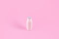 Natural liquid yogurt with probiotics in small plastic bottles on pink background. Healthy, balanced diet food, healthy breakfast