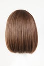 Natural looking dark brunet wig on white mannequin head