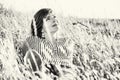 Natural lovely woman posing in the summer meadow, black and whit