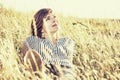 Natural lovely woman posing in the summer meadow, yellow photo f