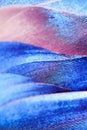 Natural macro background of bird feathers. Blue, pink and purple tone.