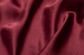 Natural magenta red silk fabric with folds texture Royalty Free Stock Photo