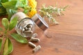 Natural medicine capsules in open glass jar on wood table Royalty Free Stock Photo