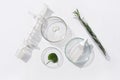 Natural medicine cosmetic research bio science organic skin care products. Serum glass bottle with pipette in petri dish on