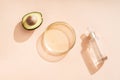 Natural medicine glass labware, petri dishes, cream jars, scrub, aromatic oils. Avocado oil natural cosmetic background