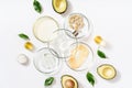 Natural medicine glass labware, petri dishes, cream jars, scrub, aromatic oils. Avocado oil natural cosmetic background