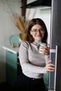 Natural milk Greek yogurt in the hands of a young woman, diet food Royalty Free Stock Photo