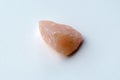 Natural mineral crystal of rose quartz gemstone. Natural rose quartz crystal. White background Royalty Free Stock Photo