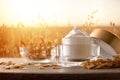 Natural moisturizing cream with oat extract in field on table Royalty Free Stock Photo