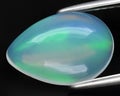natural multi color rainbow opal gem on the background Royalty Free Stock Photo