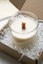 Natural new soy wax candle with wooden wick in clear glass jar Royalty Free Stock Photo