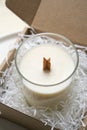 Natural new soy wax candle with wooden wick in clear glass jar Royalty Free Stock Photo