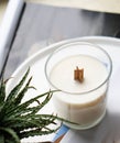 Natural new soy wax candle with wooden wick in clear glass jar Royalty Free Stock Photo