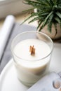 Natural new soy wax candle with wooden wick in clear glass jar Royalty Free Stock Photo